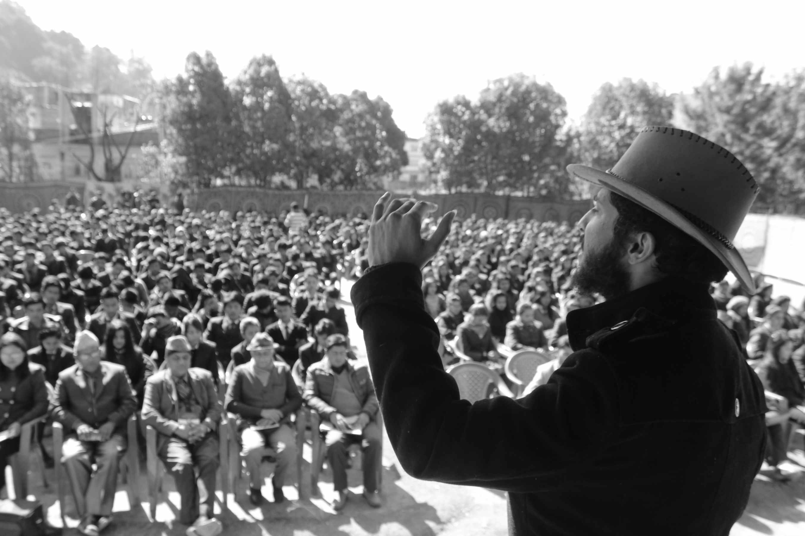 Saunak Bhatta speaking to a packed auditorium